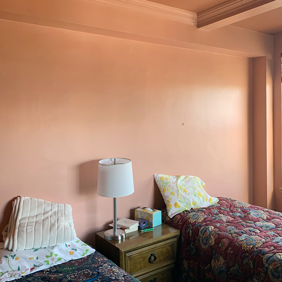 pink bedroom with two twin beds