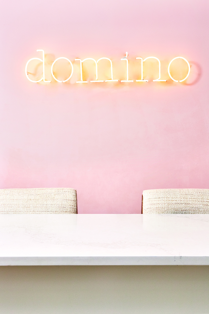 domino in neon letters