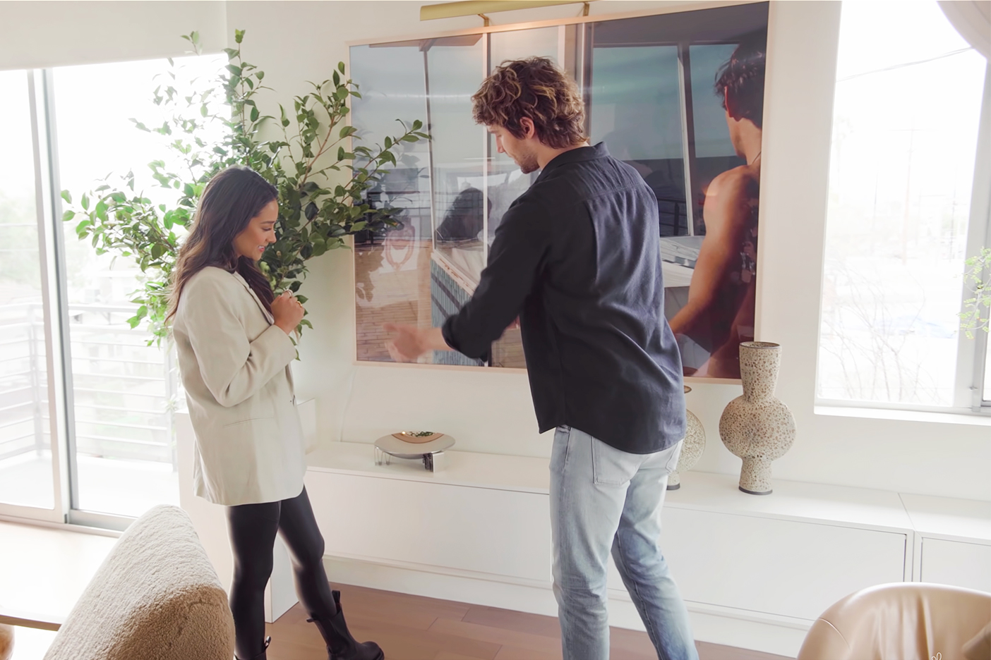 man and woman looking at credenza