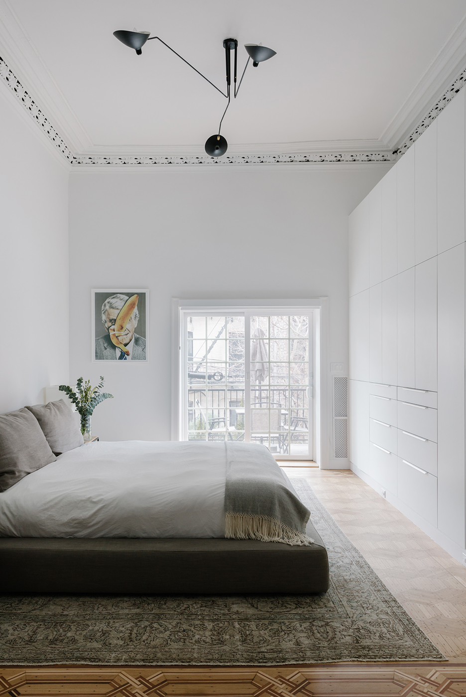 wall of white cabinets in bedroom