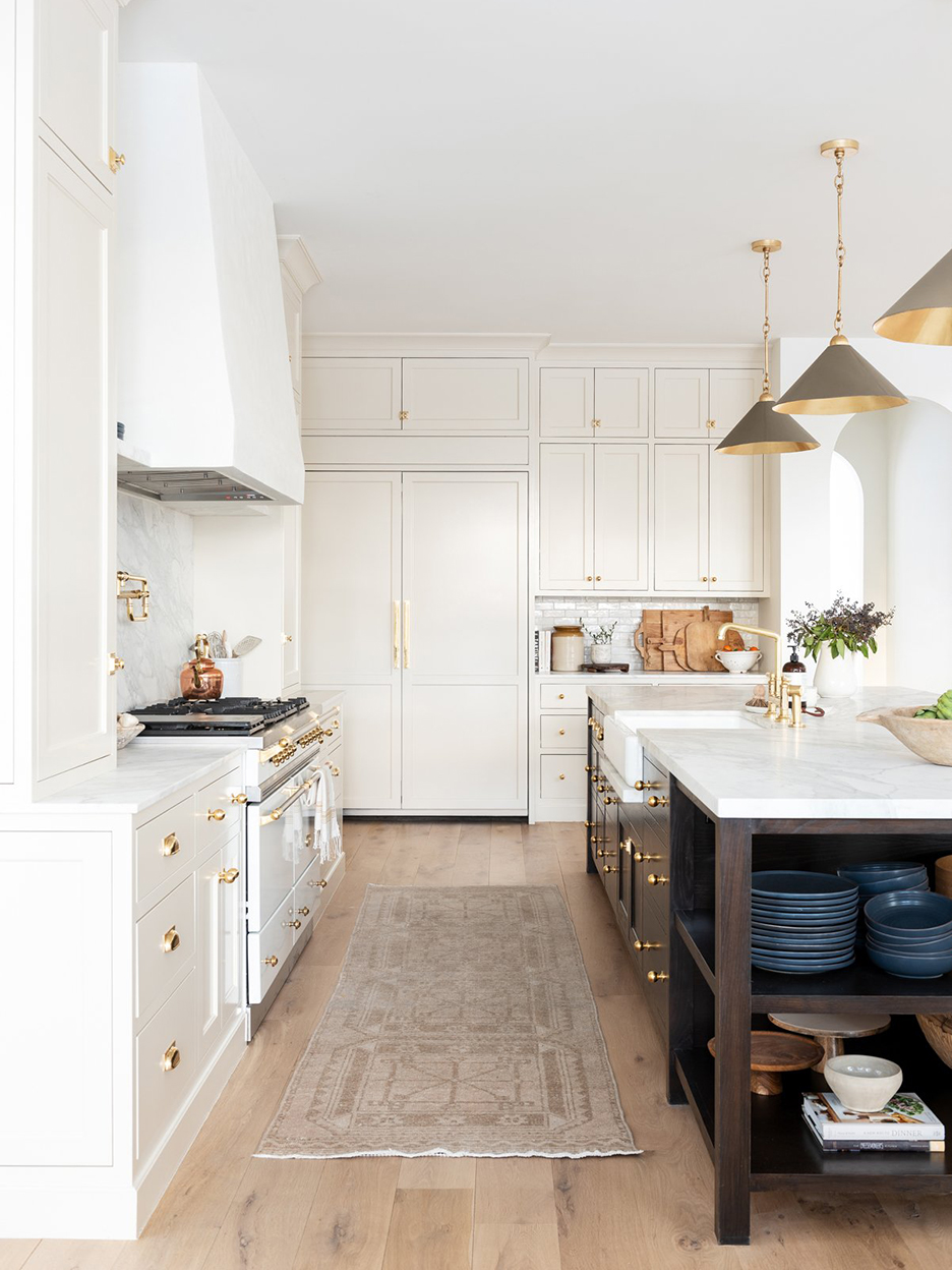 white kitchen with blue island