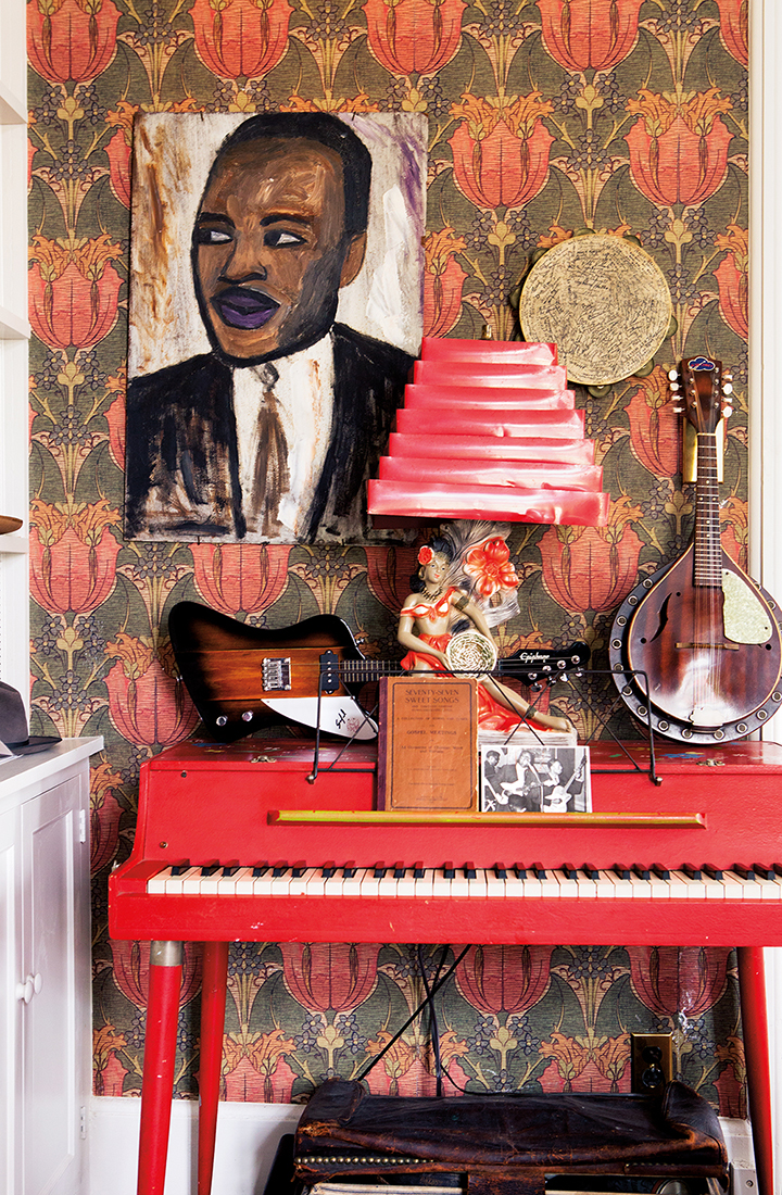 red piano with art