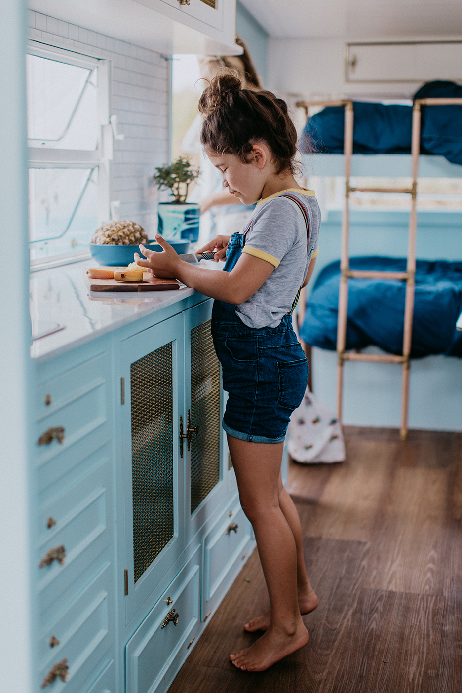 girl cutting fruit