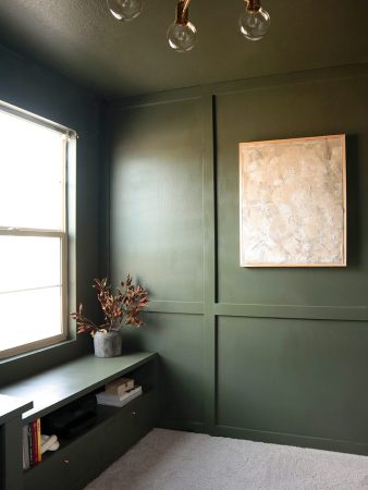 dark green paneled wall