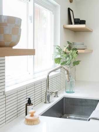 shite countertop with metal sink