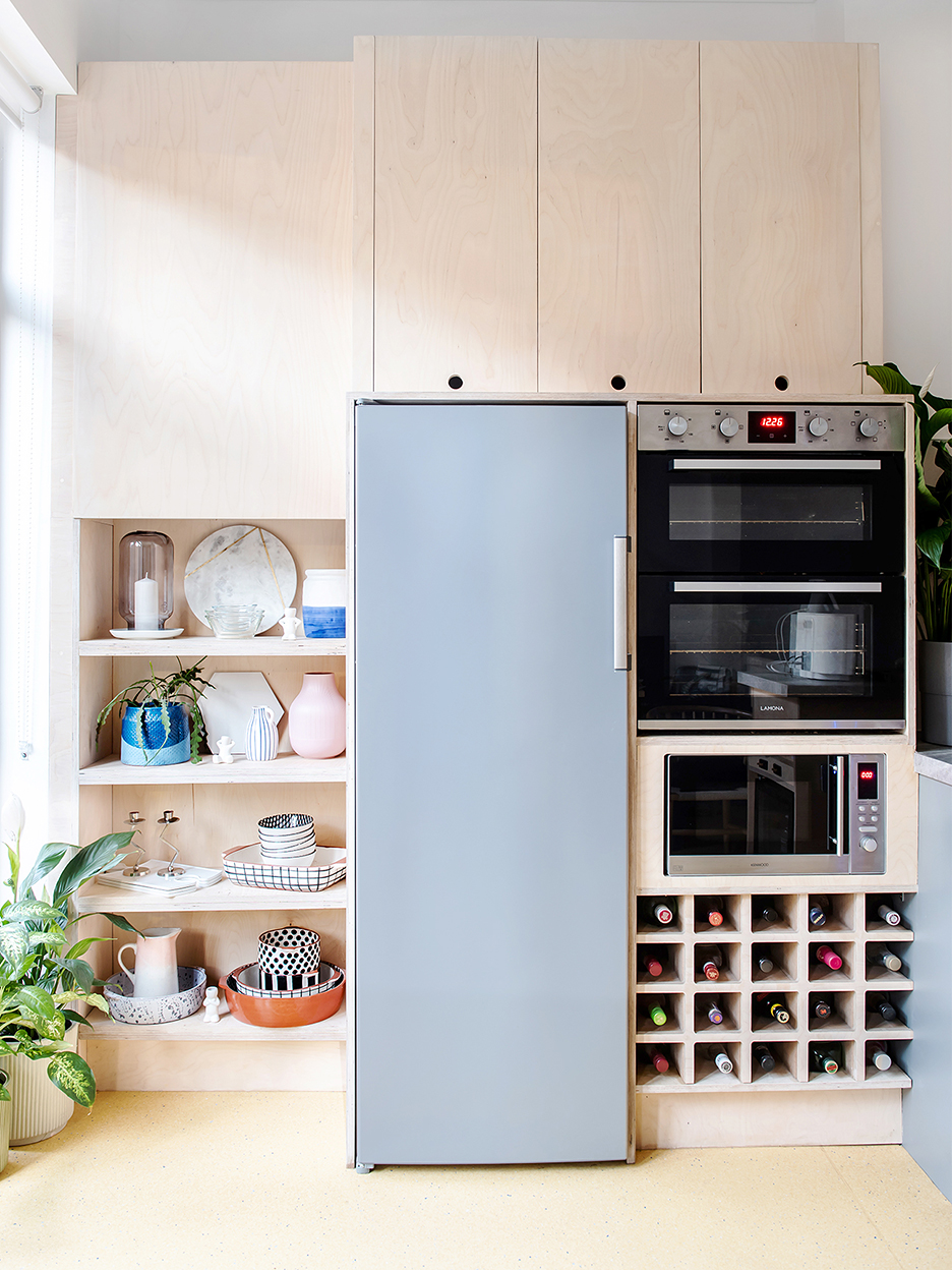 blue fridge in light wood kitchen