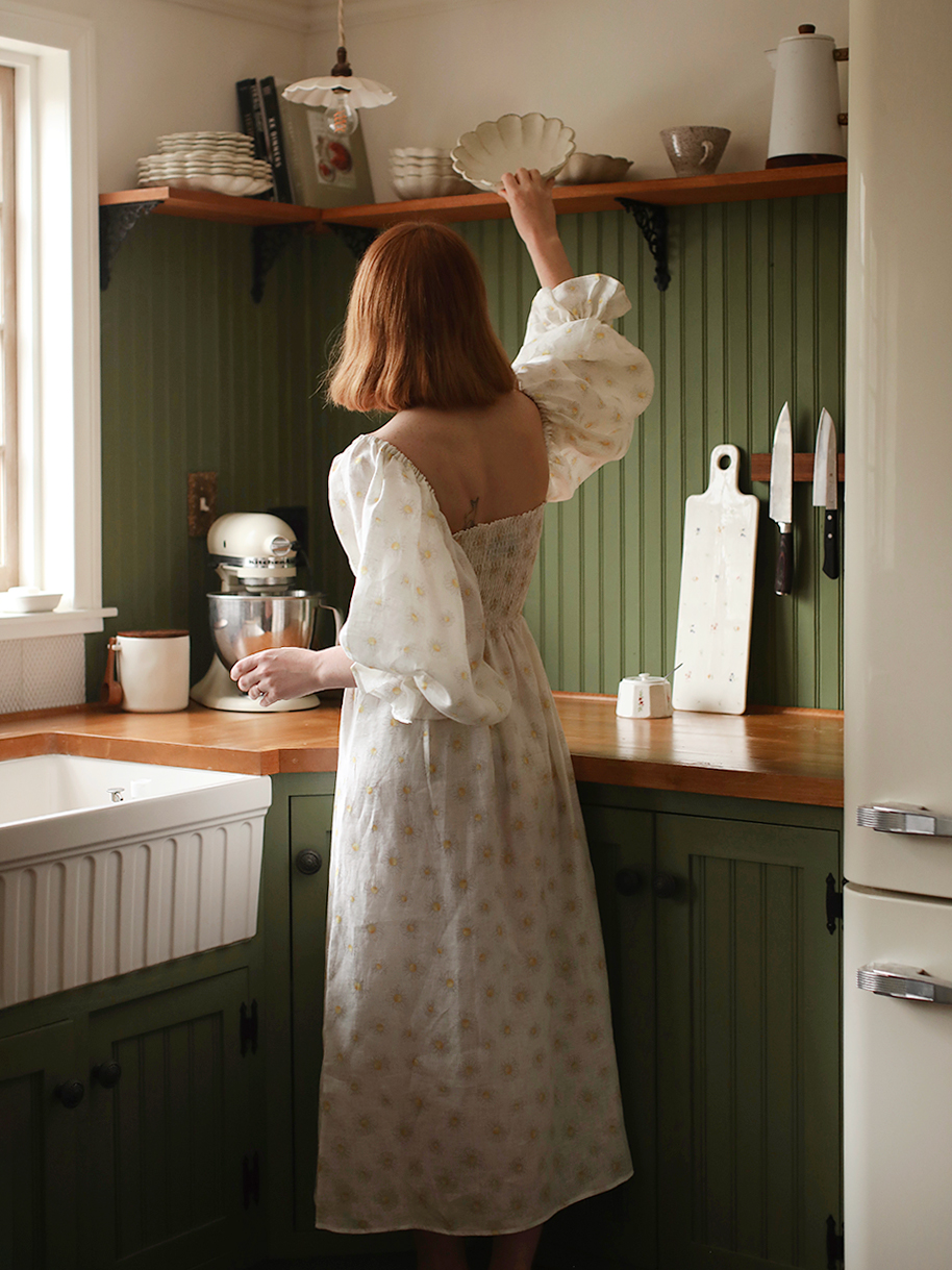 woman grabbing stuff from shelf