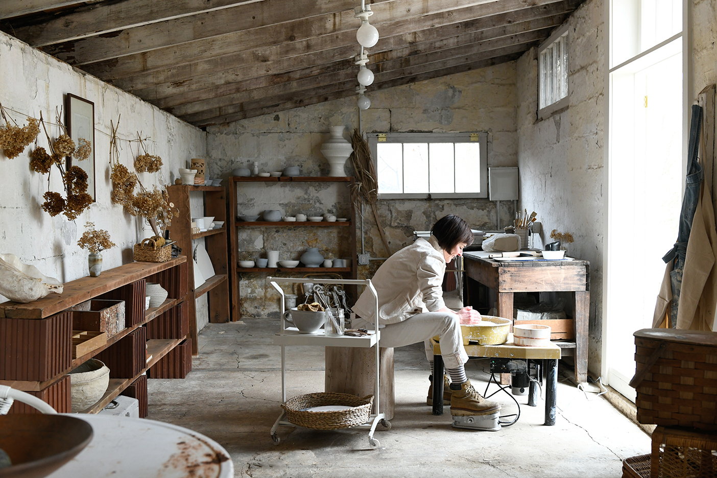 woman at pottery wheel