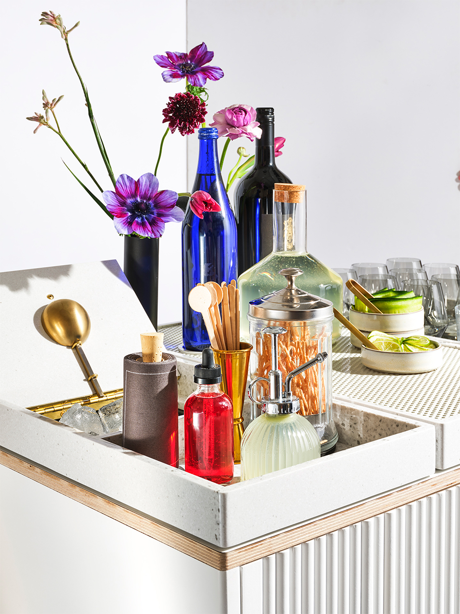 tray of cocktail tools in colorful vessels