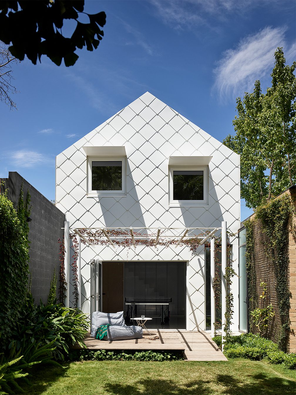 modern home with large white diamond shingles