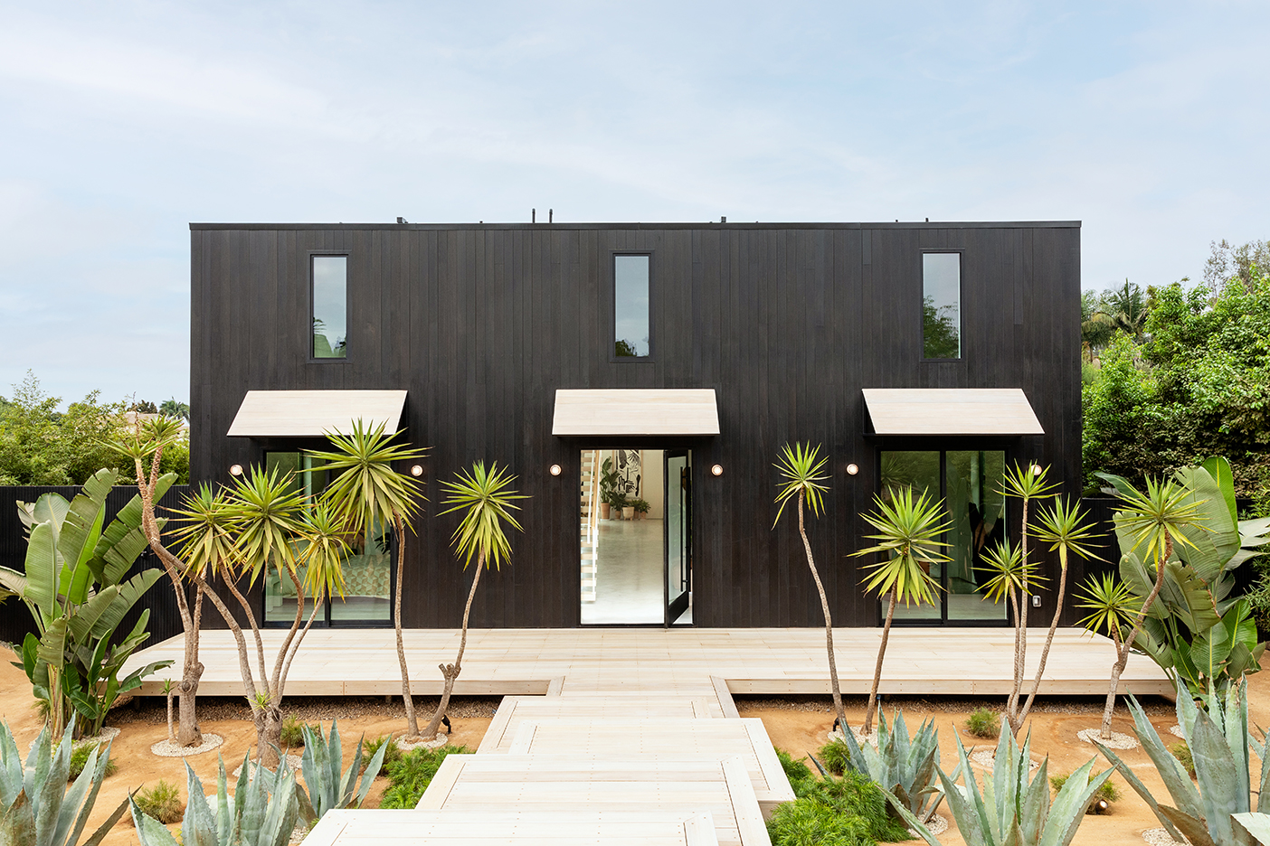 black house exterior with awnings