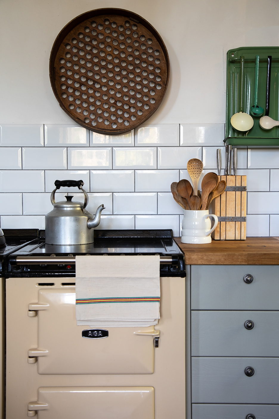 vintage stove and subway tile backsplash