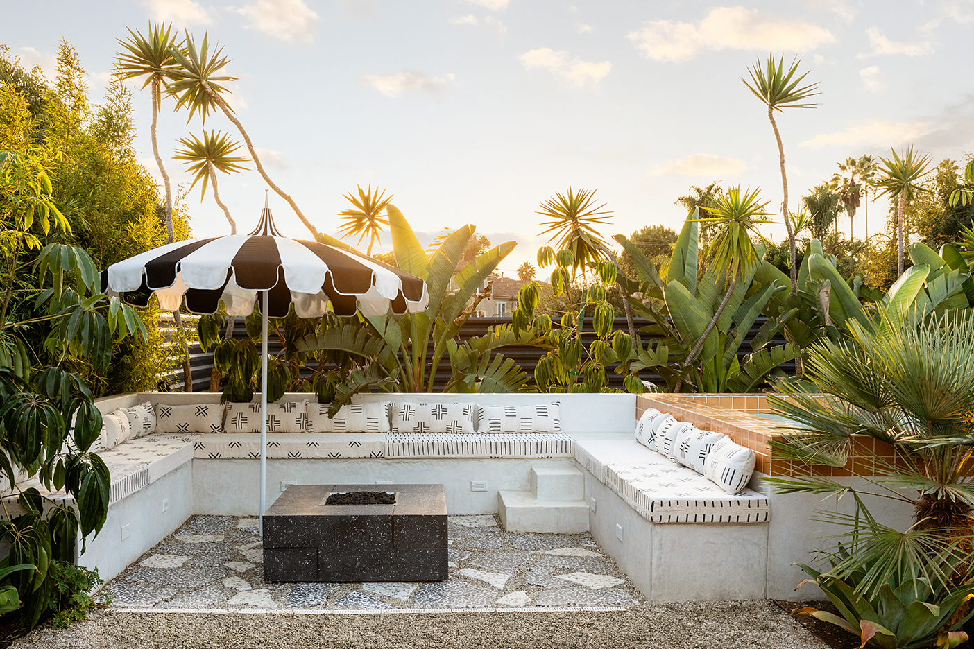 built-in outdoor seating with striped umbrella