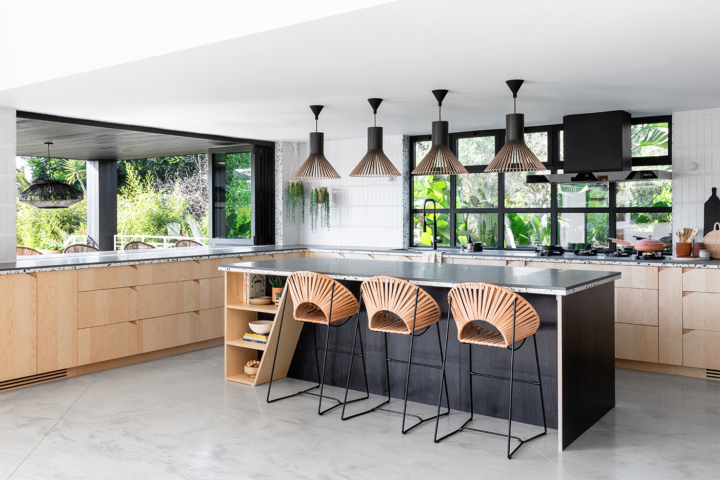 black kitchen island, wood cabinets