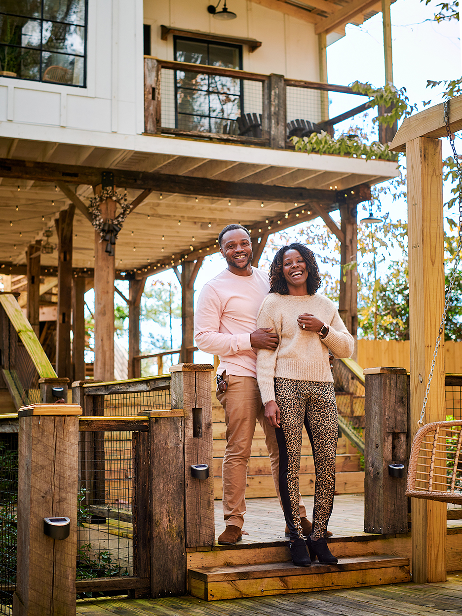 couple outside tree house