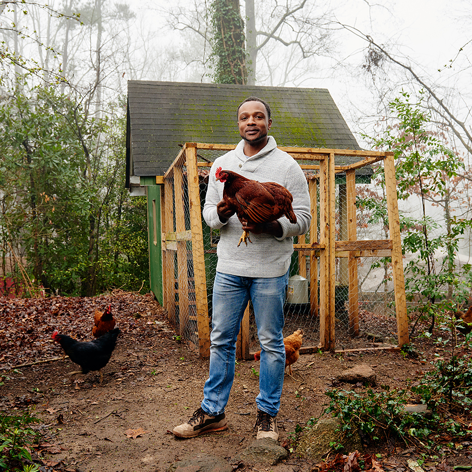 man holding chicken