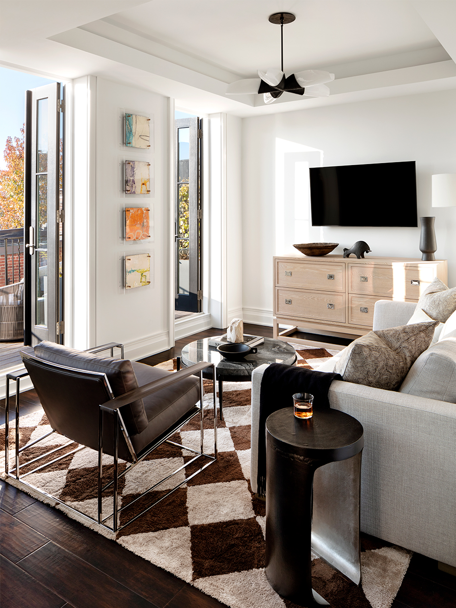 Sitting area with checkerboard rug and french doors