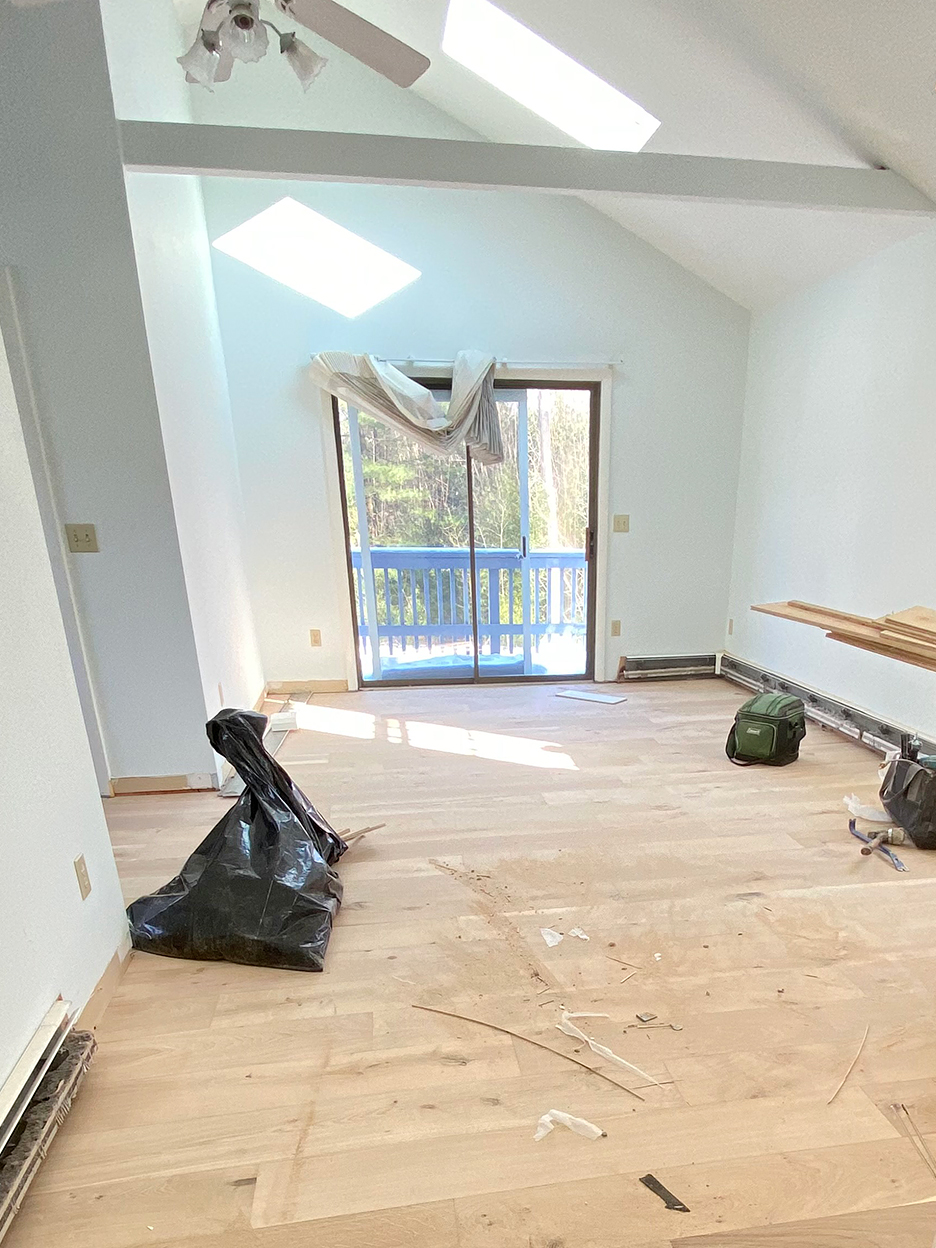 undecorated room with newly finished wood floors