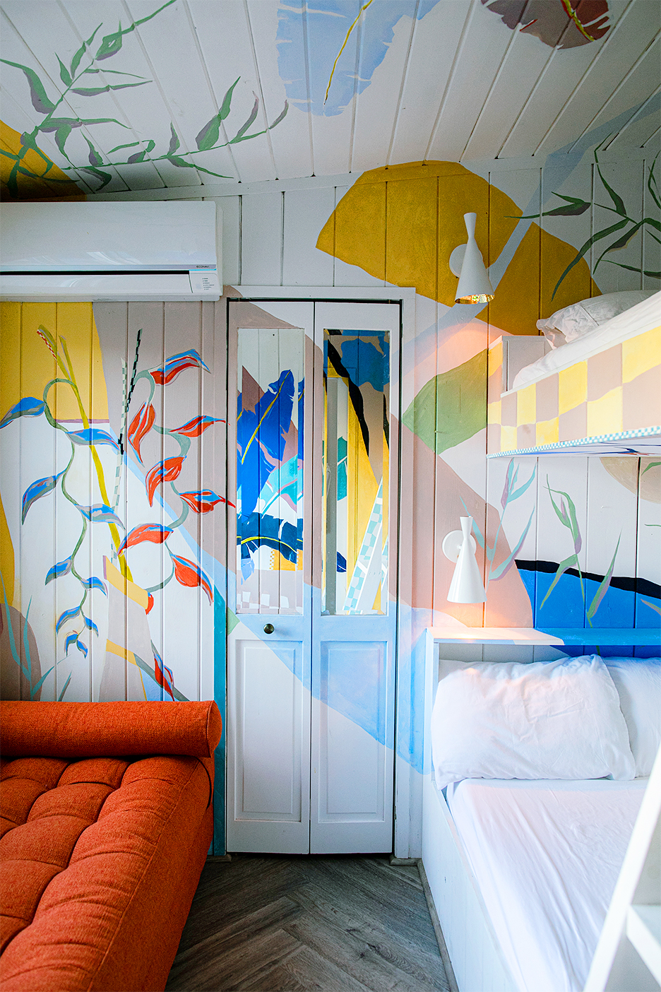 Painted mural on walls and bunk beds