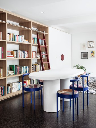 dining room with bookcase wall