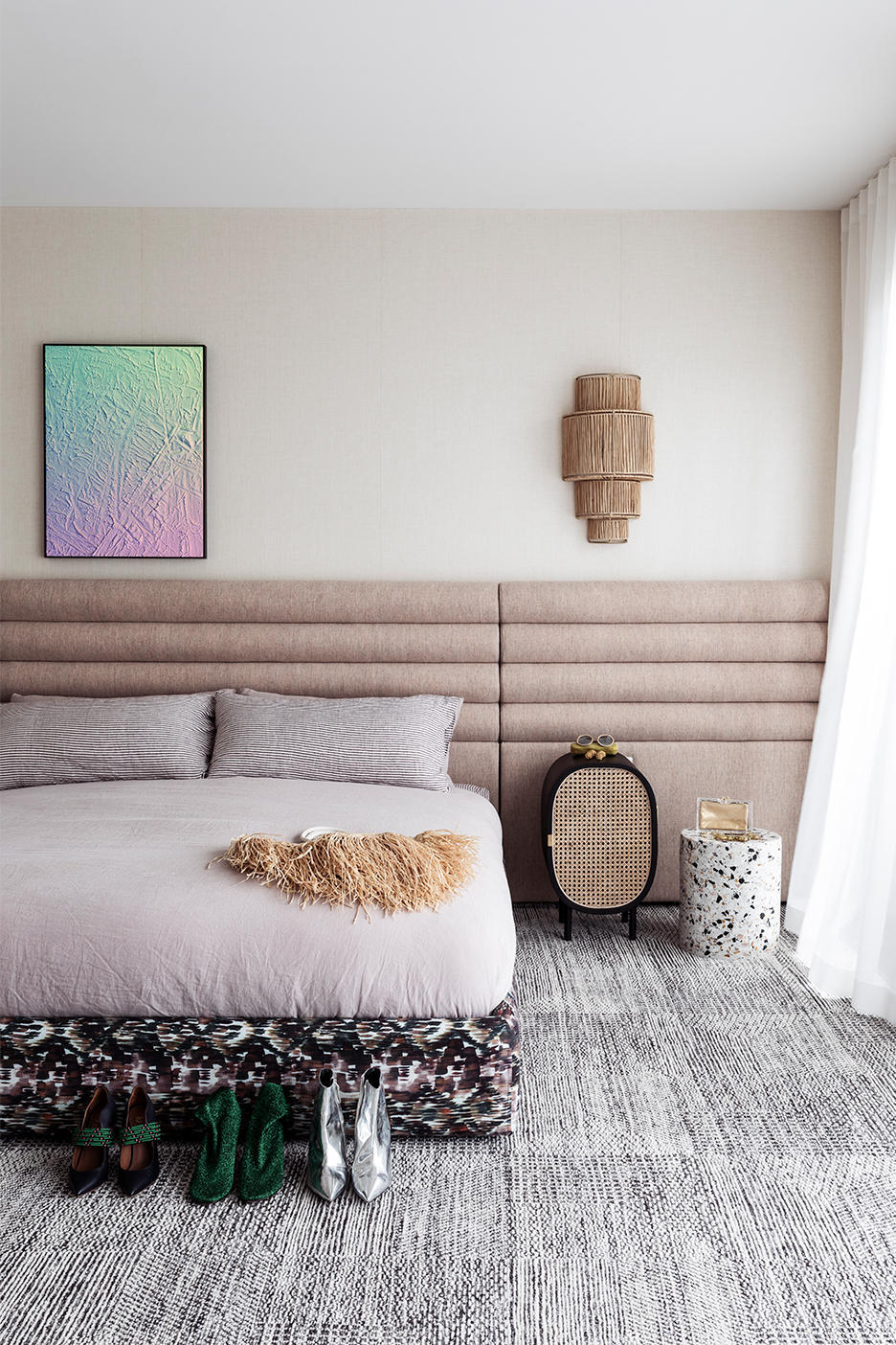 bedroom with blush channel-tufted headboard