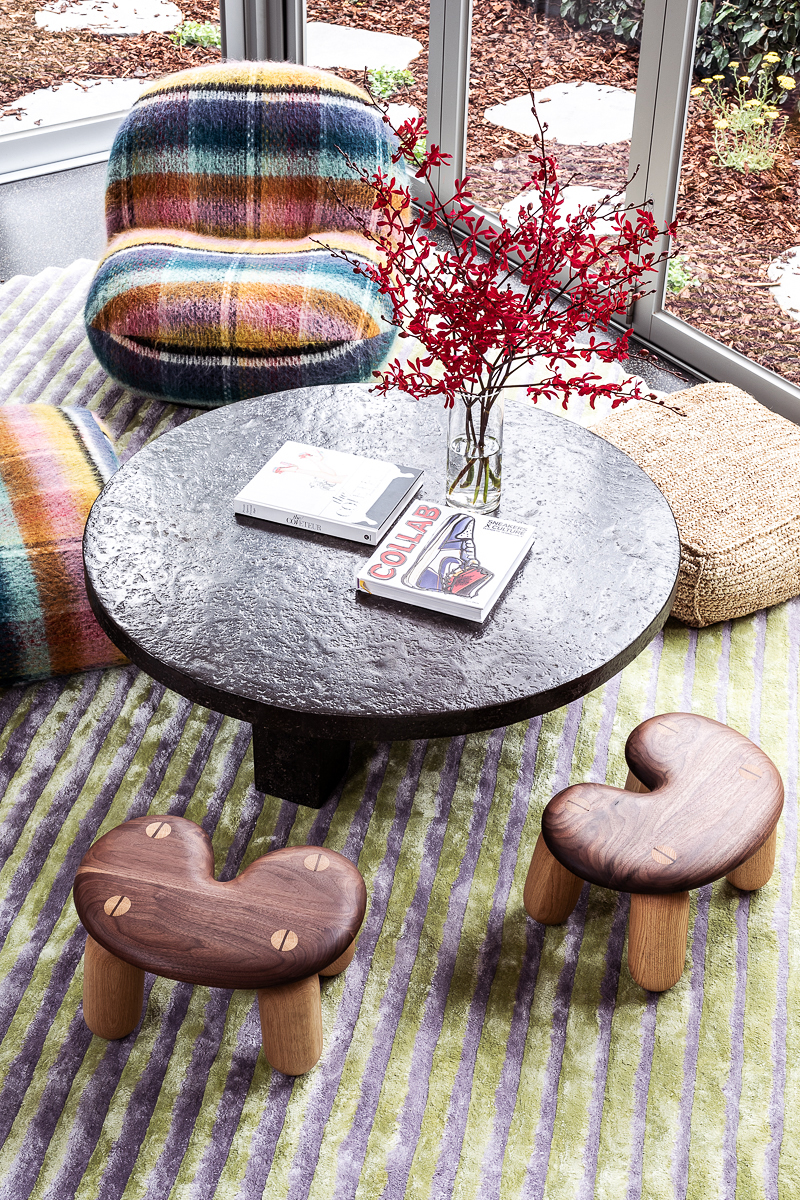 rainbow plaid chair and wood stools