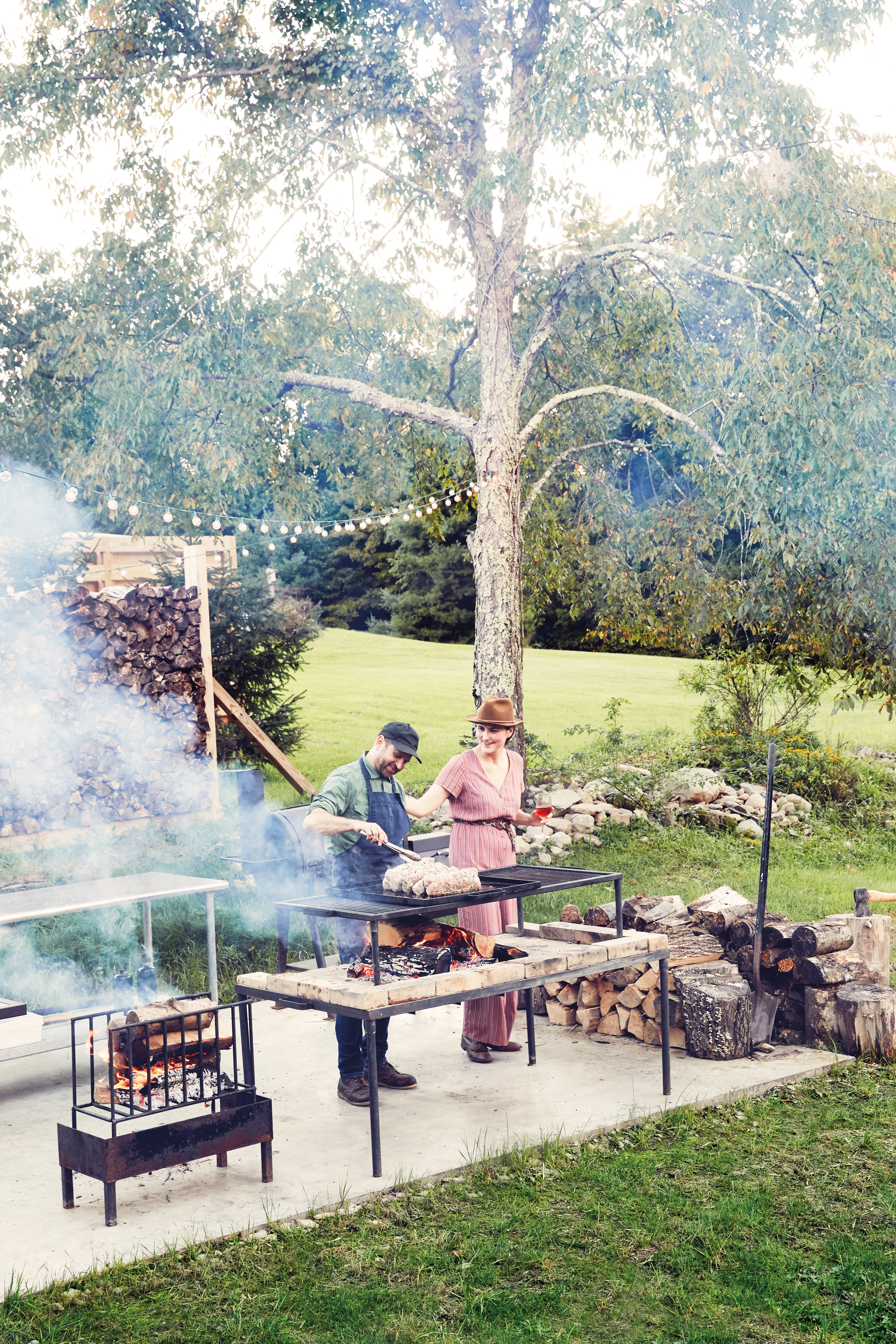 woman and man grilling outside