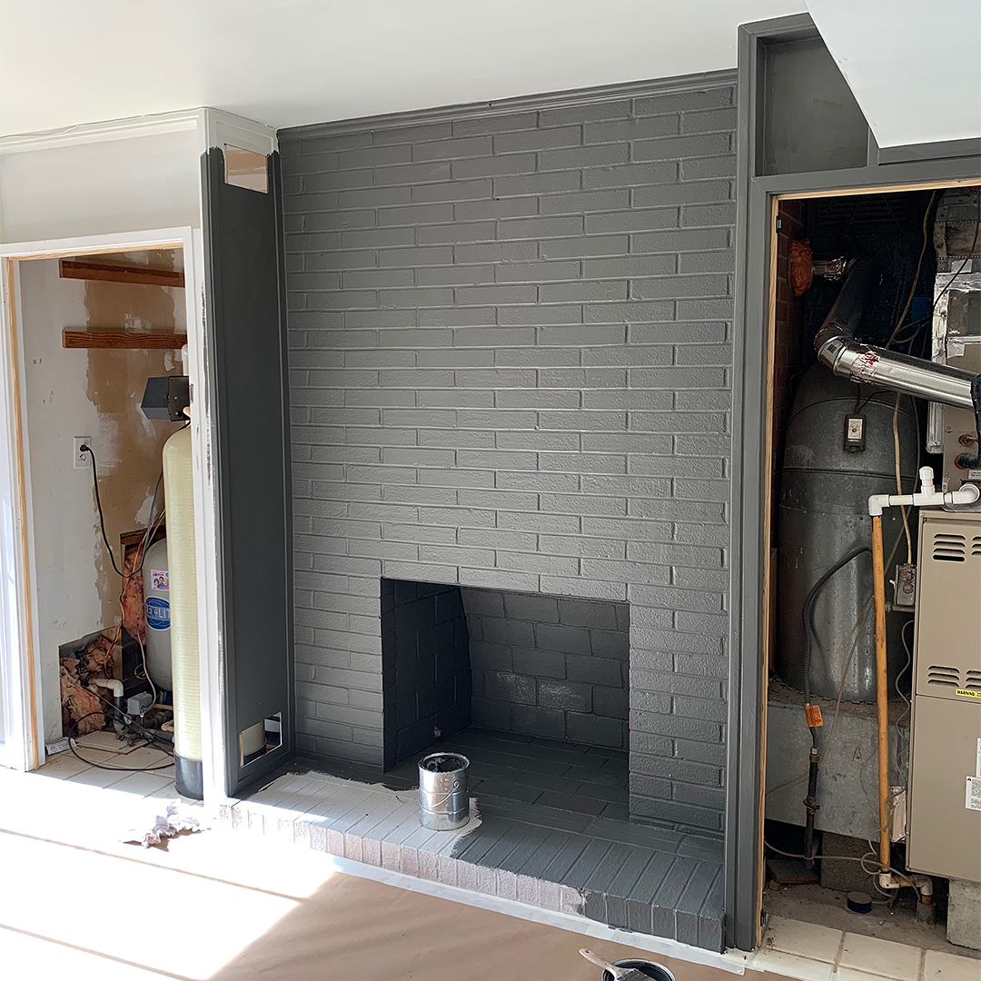 black fireplace being painted