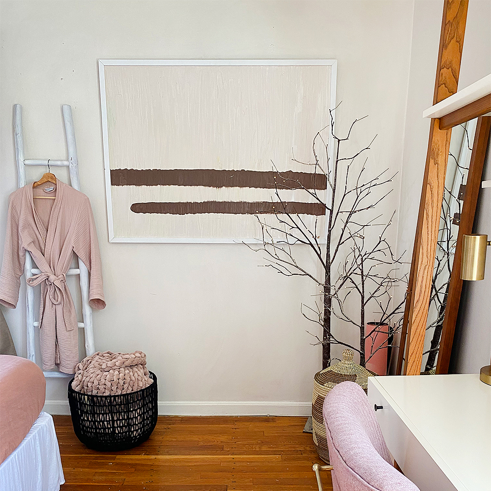 Room with hanging robe and desk