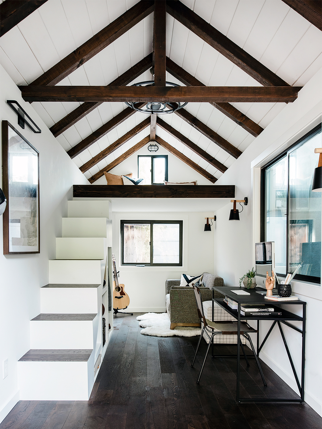 Teen's white and wood loft house in backyard.