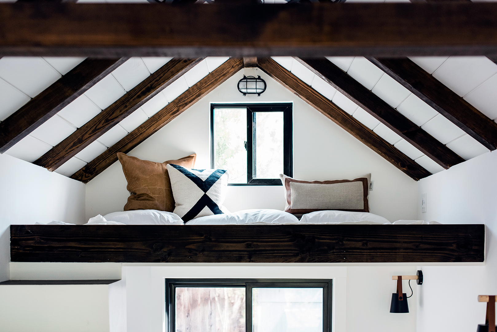 Teen's loft bed in outdoor bunkhouse.