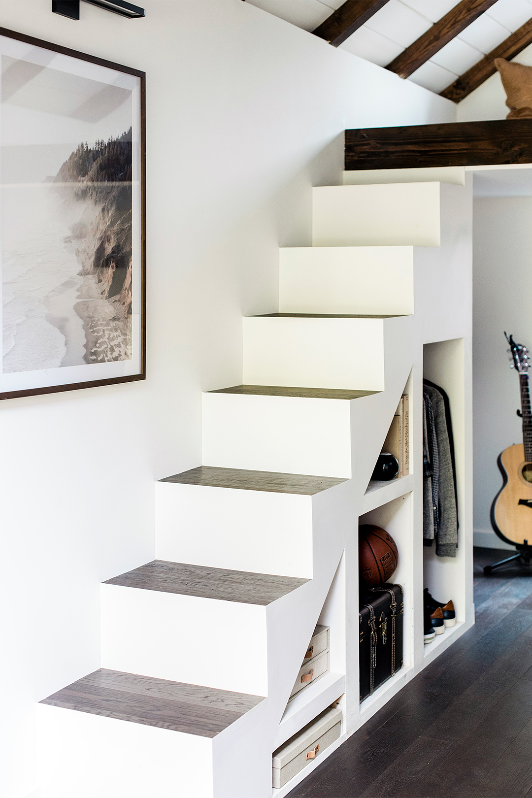 Stairway in a teen's outdoor bunkhouse, painted white.