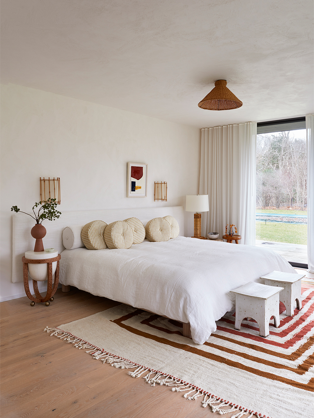 modern bedroom with striped rug