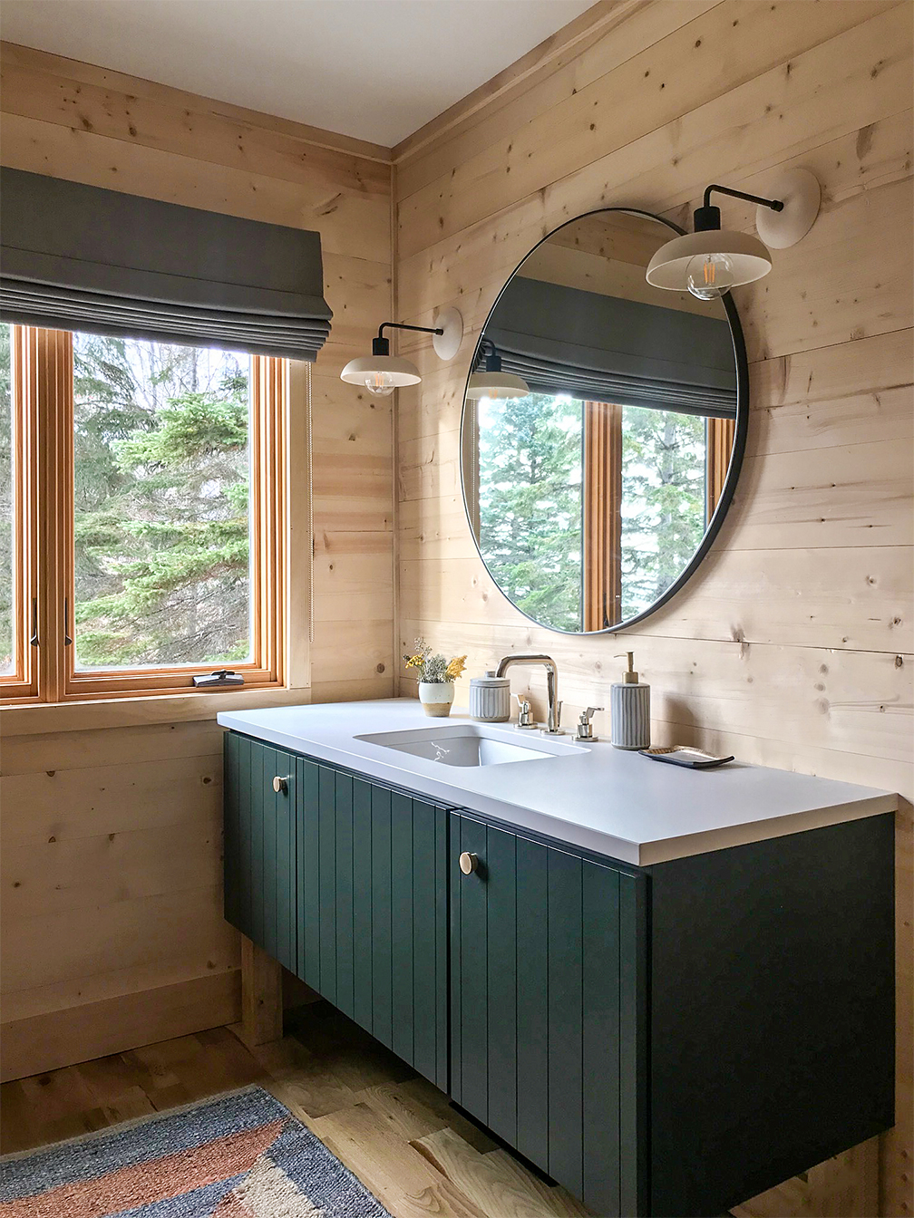 wood-paneled bathroom with green vanity
