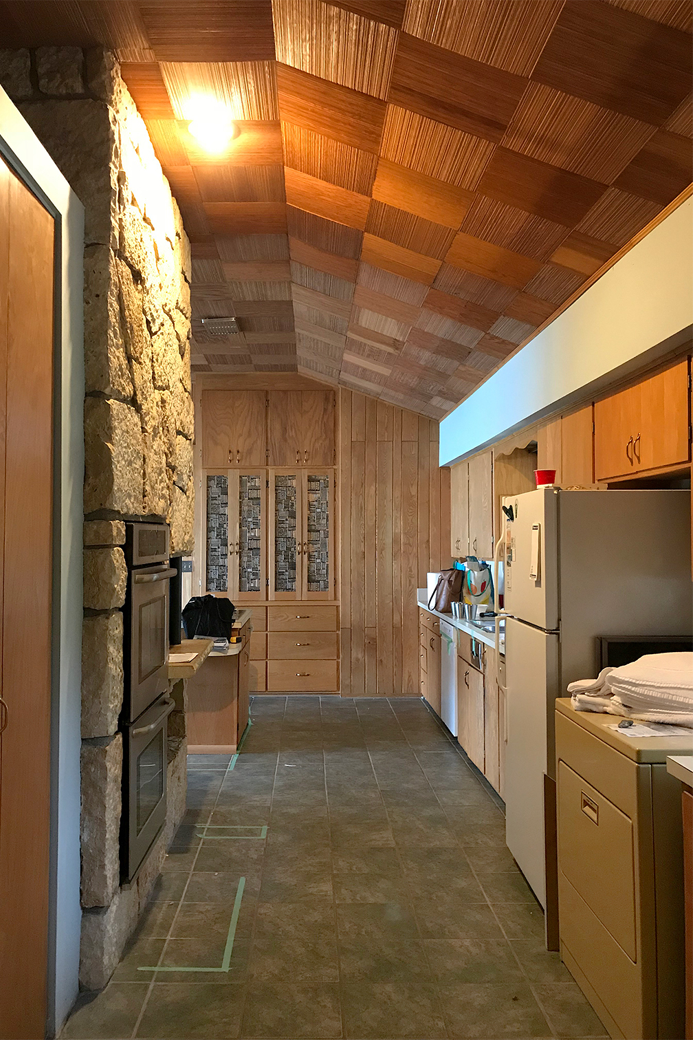 dated wood kitchen with parquet wood ceiling