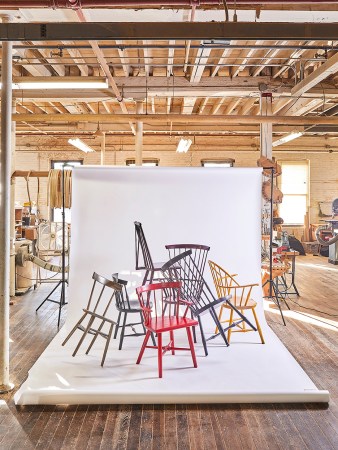 Windsor chairs stacked on top of each other