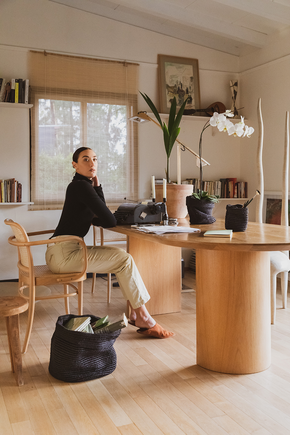 Mia Moretti sitting at her desk