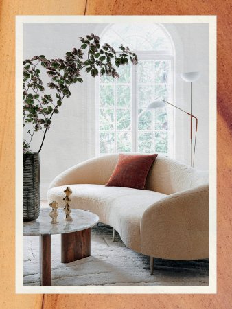 Double Leather Floor Lamp Behind Curved Couch