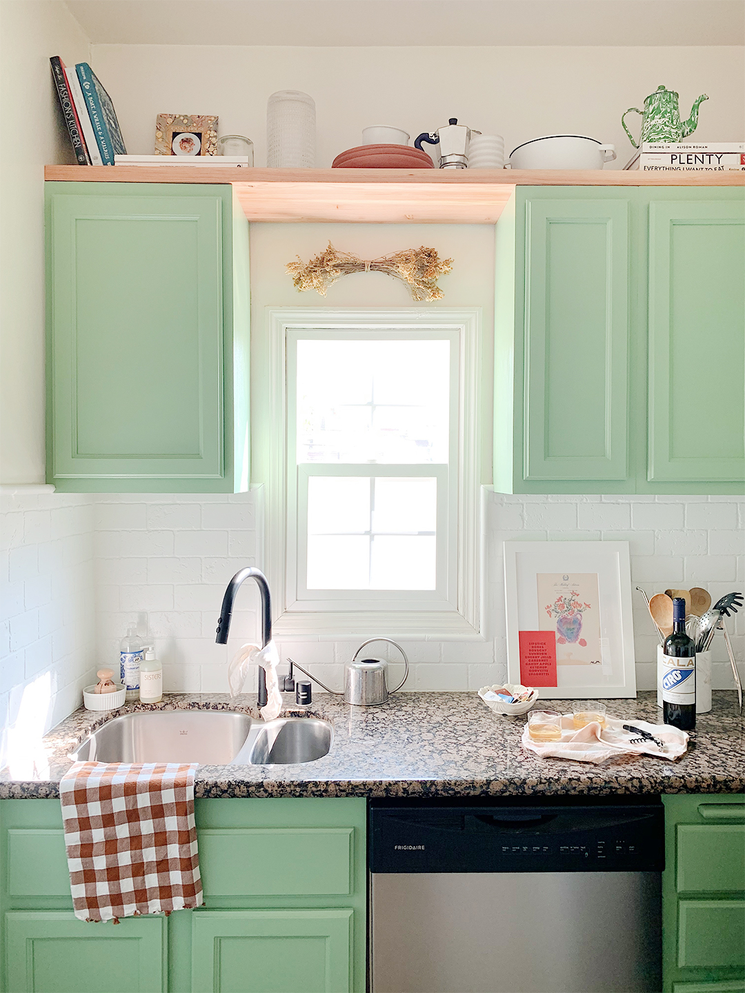 wood shelf above green uppers