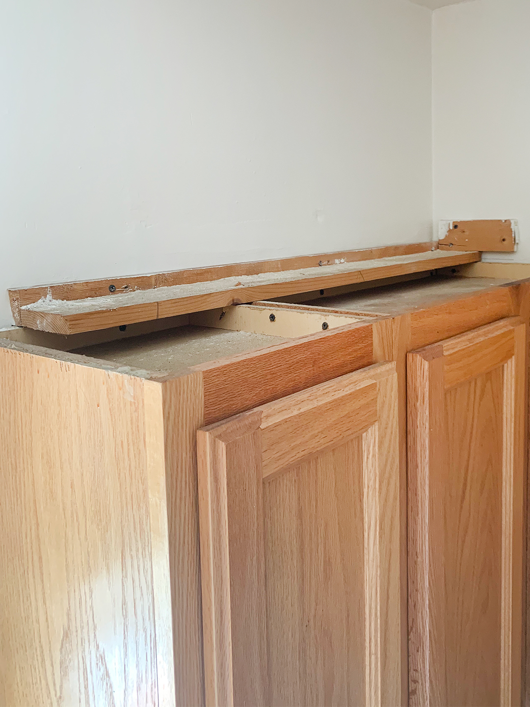 dusty top of upper cabinets before