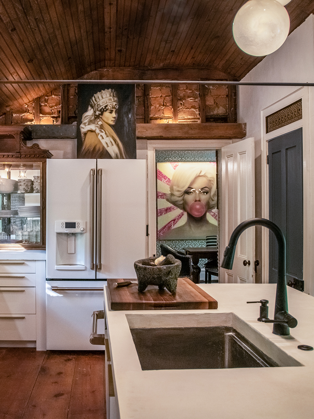 kitchen with wood ceiling and concrete island