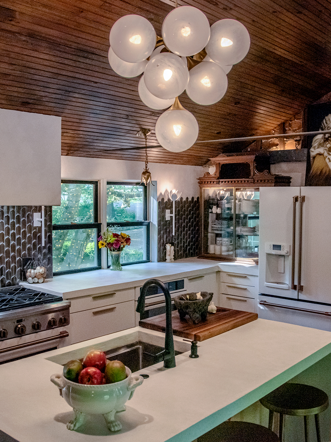 bubble pendant light above concrete kitchen island