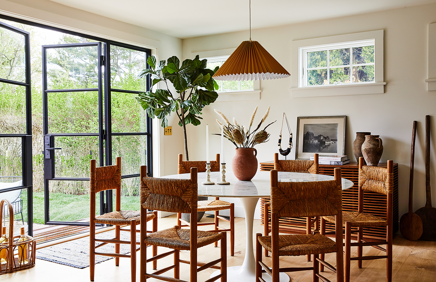 dining room with woven chairs