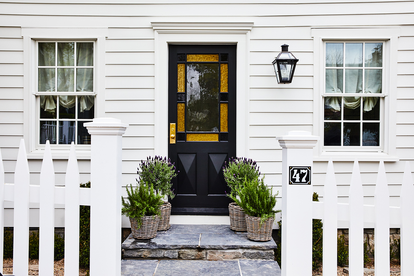 house entrance with black stained glass door