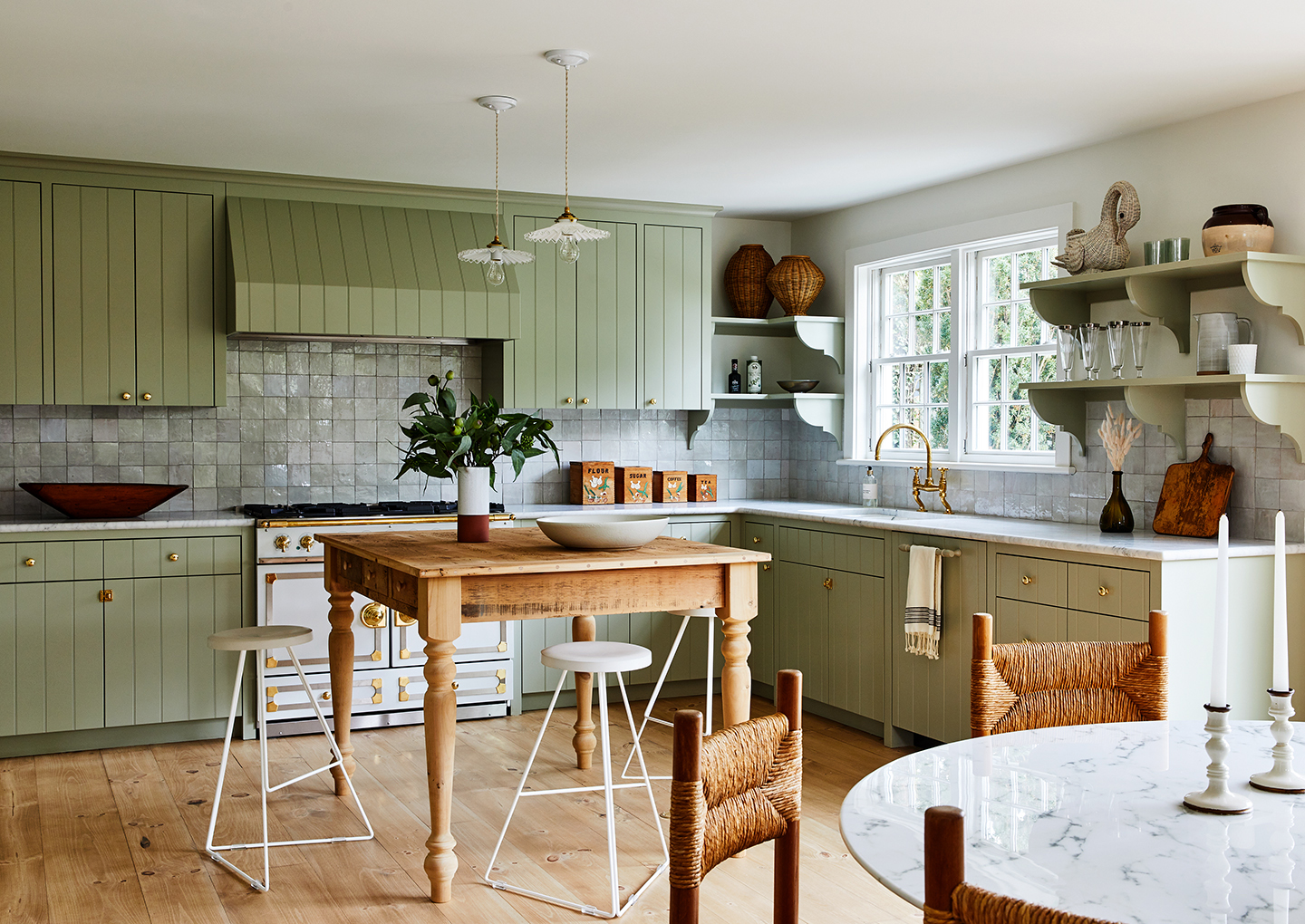 kitchen with table island and green cabinets