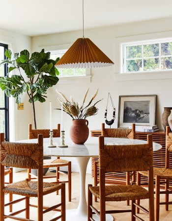 dining room with woven chairs