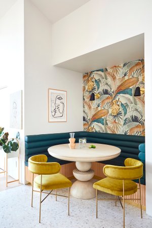 curved table and yellow dining chairs