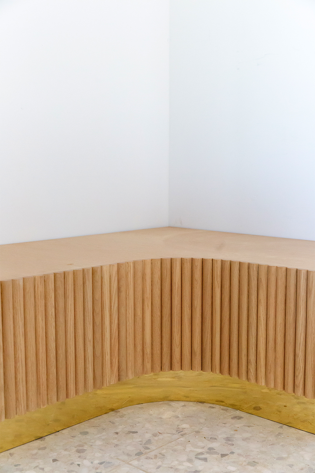 curved wood dowel clad bench