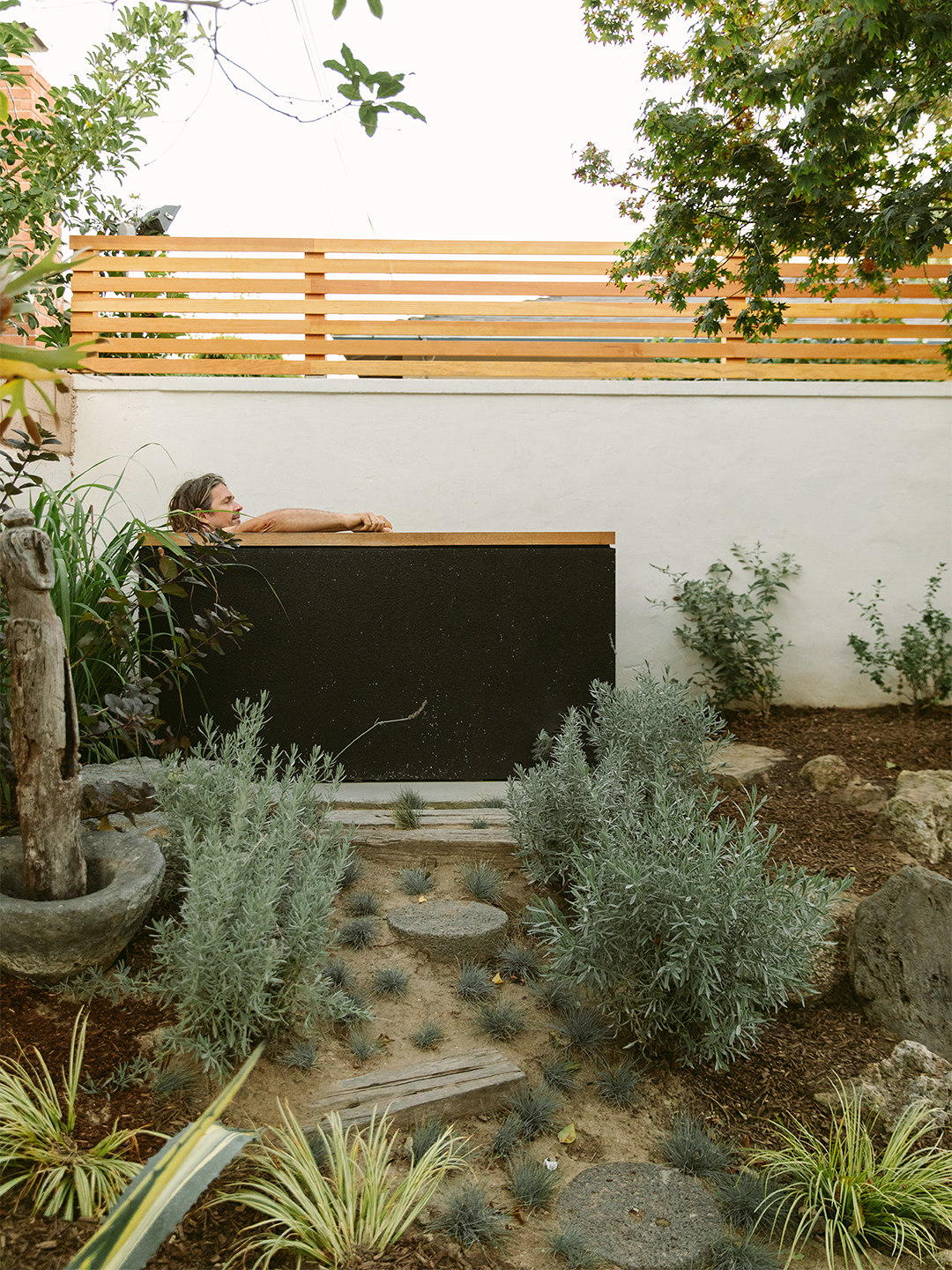 man soaking in tub