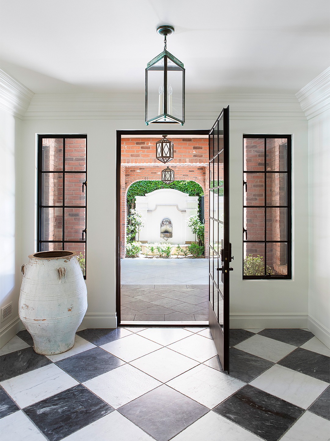 door looking onto outdoor fountain